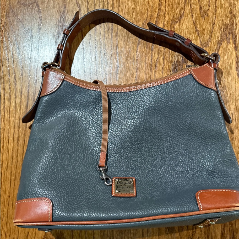 Dooney and Bourke pebble grain hobo purse in midnight blue with Brown Trim